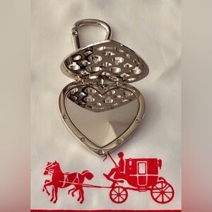 NWOT Silver Mirror heart-shaped locket keychain or bag charm with a cutout